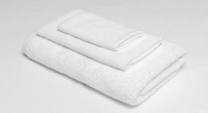 a stack of white towels on a white background at America's Best Inn - Brinkley in Brinkley