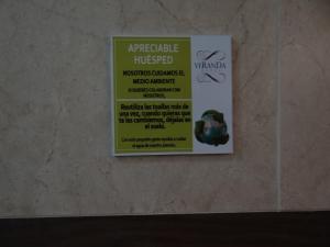 Certificado, premio, señal o documento que está expuesto en Veranda Hotel