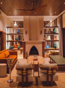 a living room with a couch and a fireplace at Villa Dar Al Hayat in Marrakesh