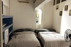 Giường trong phòng chung tại caipiriña mix