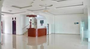 a large room with white walls and a ceiling at OPRISS HOTEL in Parapat