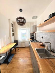 a kitchen with a sink and a counter top at ParkView in Craiova