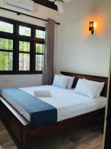 Voodi või voodid majutusasutuse Solara Stay Dickwella toas