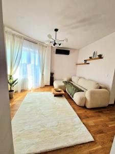 a living room with a couch and a rug at ParkView in Craiova
