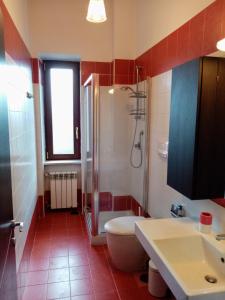 a bathroom with a shower and a toilet and a sink at Oasi di Frattamaggiore in Frattamaggiore