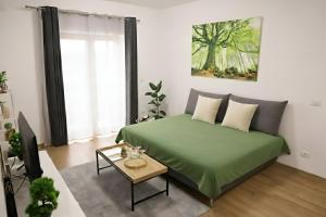 Ένα ή περισσότερα κρεβάτια σε δωμάτιο στο Hushu Apartment +11 φωτογραφίες