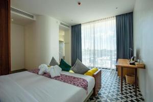 Ένα ή περισσότερα κρεβάτια σε δωμάτιο στο K.K inn Boutique Siem Reap