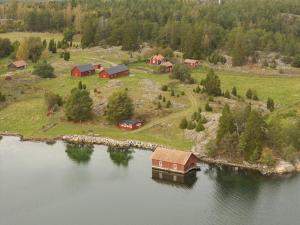 an aerial view of a house on an island in the water at Horsvik - Hagstugan in Studsvik +16 photos