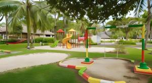 a park with a playground with a slide at Tanjung Lesung Beach Hotel in Kalicaah