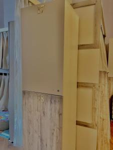 a room with a wall with a door in it at Hifzas Hostel in Baku