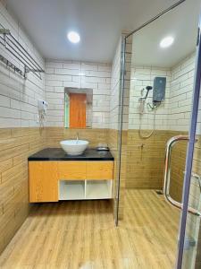 a bathroom with a sink and a shower at Cacua villa 6 bedrooms in Phu Quoc