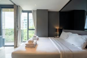 Postel nebo postele na pokoji v ubytování Seaphere Residence by Prop Hopper