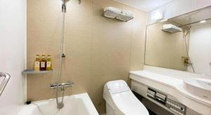 a bathroom with a toilet and a sink and a shower at Imazu Sun Bridge Hotel in Imazu +71 photos