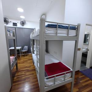 a couple of bunk beds in a room at VnV DORM HOMESTAY in Shah Alam +143 photos