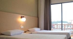 Ένα ή περισσότερα κρεβάτια σε δωμάτιο στο Lipis Plaza Hotel +35 φωτογραφίες