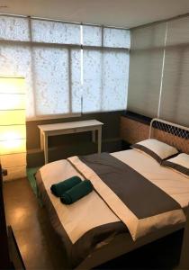 Ένα ή περισσότερα κρεβάτια σε δωμάτιο στο Koptel Budget Hotel