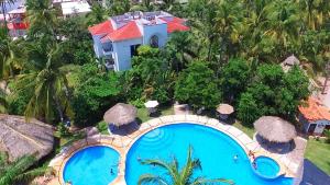 an aerial view of a resort with a swimming pool at Hotel Hacienda de Melaque in San Patricio Melaque +53 photos