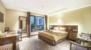 Ένα ή περισσότερα κρεβάτια σε δωμάτιο στο Thang Loi Tam Dao Hotel +158 φωτογραφίες