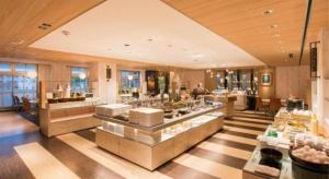 a restaurant with a buffet line in a building at Yuzawa New Otani in Yuzawa