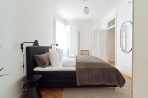 Ένα ή περισσότερα κρεβάτια σε δωμάτιο στο 2BR Oasis in the heart of CPH