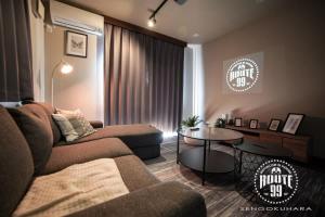 a living room with a couch and a table at Route 99 Sengokuhara in Sengokuhara