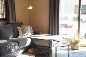 a living room with a couch and a glass table at Route 99 Sengokuhara in Sengokuhara +53 photos