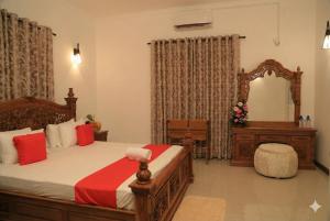 Giường trong phòng chung tại Alakamandawa villa and Restaurant kadawatha