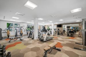 a gym with treadmills and exercise equipment in a building at Modern 2BR Cozy Apartment in Irvine in Lake Forest