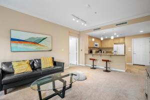 a living room with a couch and a glass table at Modern 2BR Cozy Apartment in Irvine in Lake Forest