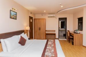 Postel nebo postele na pokoji v ubytování Hotel Mirage Regency