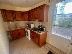 Kuchyň nebo kuchyňský kout v ubytování Beaurivage