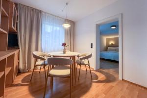 Кровать или кровати в номере Brunnalm Blick Apartment