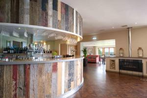 a lobby with a bar with a large wall at Landal Whitbarrow in Penruddock