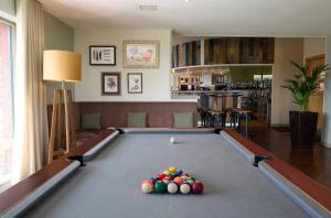 a pool table with balls on it in a living room at Landal Whitbarrow in Penruddock
