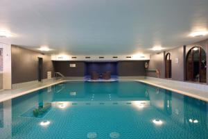 a large swimming pool in a hotel room at Landal Whitbarrow in Penruddock