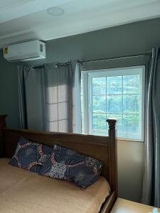 Postel nebo postele na pokoji v ubytování Ankyease Aclove