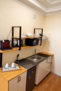 Nhà bếp/bếp nhỏ tại Mutamba City View Apartment