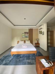 Postel nebo postele na pokoji v ubytování The Daun Bali + 27 fotografií