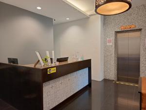 an office with a reception desk and a counter at SO Hotel in George Town