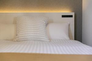 Postel nebo postele na pokoji v ubytování Living like hotel Hakata Premium