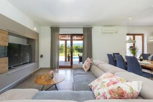 a living room with a couch and a table at Villa Flora in Kršan