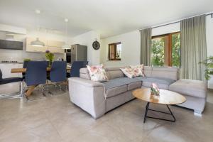 a living room with a couch and a table at Villa Flora in Kršan