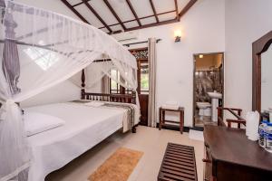 Una cama o camas en una habitación de Uyanawatta villa talpe