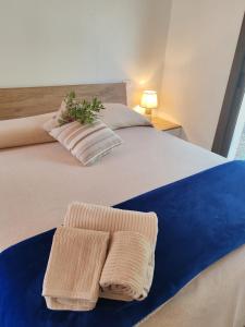 Postel nebo postele na pokoji v ubytování Smeralda Pic House