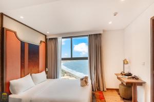 Postel nebo postele na pokoji v ubytování Apec Mandala Beach Mui Ne Resort
