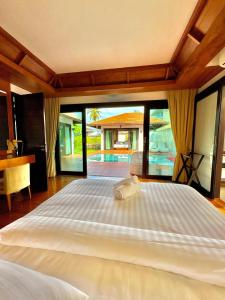 Ένα ή περισσότερα κρεβάτια σε δωμάτιο στο MAKALA Pool Villa +23 φωτογραφίες