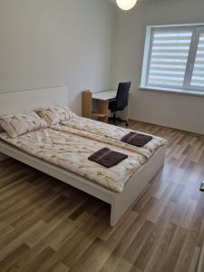 Postel nebo postele na pokoji v ubytování FB kotedžo apartamentai
