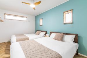 En eller flere senge i et værelse på Grandioso Okinawa Pool Villa 8 - Vacation STAY 52643v + 30 billeder