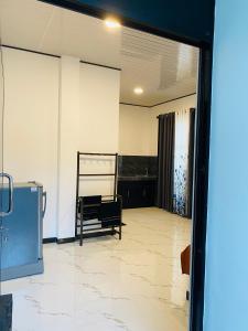 an empty room with a chair in the middle of it at Abi Restaurant & Villa in Tangalle