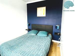 Ένα ή περισσότερα κρεβάτια σε δωμάτιο στο Charmant appartement proche des commerces et Gare +9 φωτογραφίες